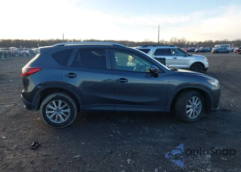 2015 Mazda Cx-5 Touring z USA, uszkodzony, nr VIN JM3KE2CY9F0489621